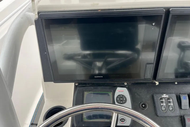 Slide: The Image of Console of a 2005 Angler 2700CC boat with Garmin navigation system. - 23