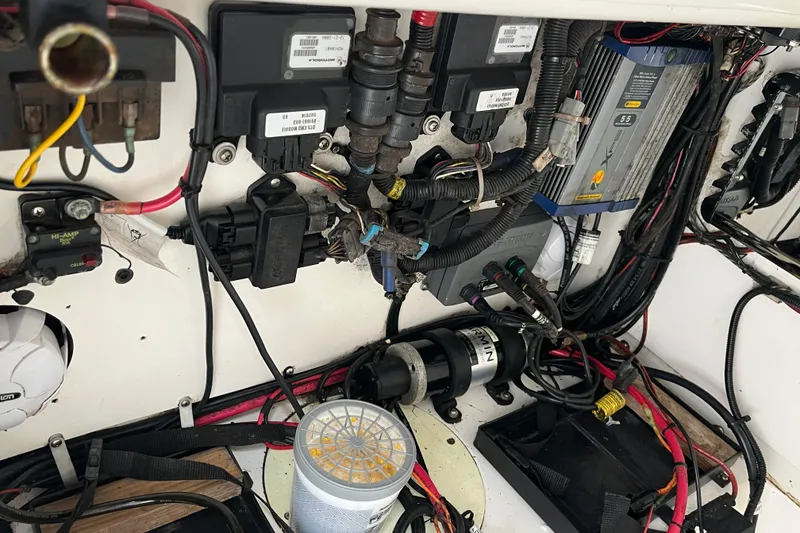 Slide: The Image of Electrical wiring and components inside a 2005 Angler 2700CC boat. - 32