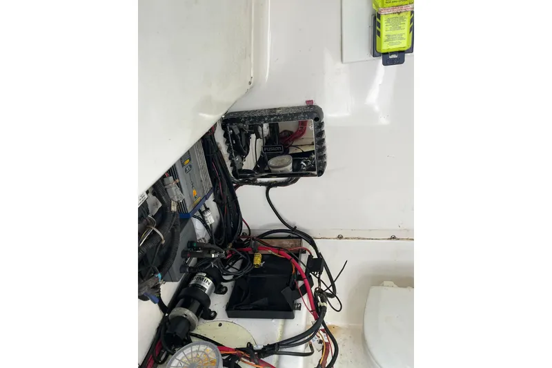 Slide: The Image of Electrical wiring and components inside a 2005 Angler 2700CC boat. - 33