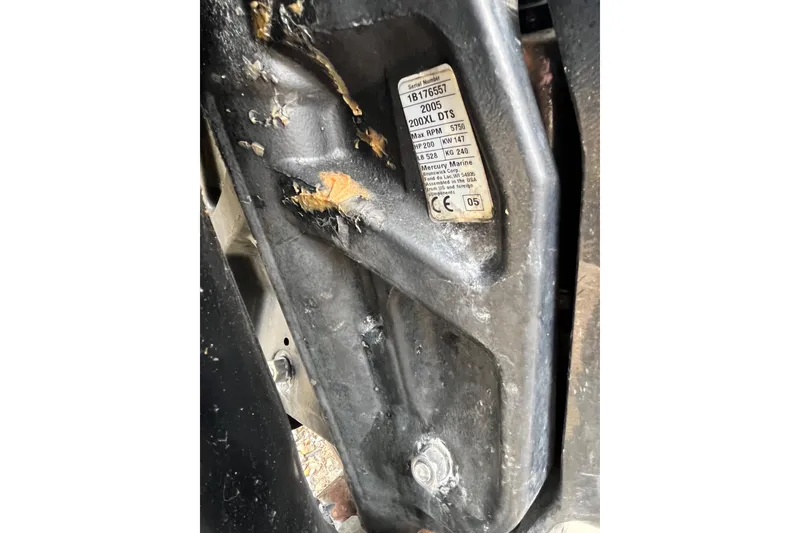 Slide: The Image of Close-up of a 2005 Angler 2700CC boat engine serial number plate. - 34