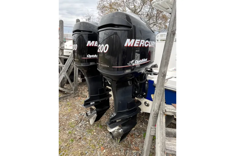 Slide: The Image of Twin Mercury OptiMax 200 outboard motors on a 2005 Angler 2700CC boat. - 8