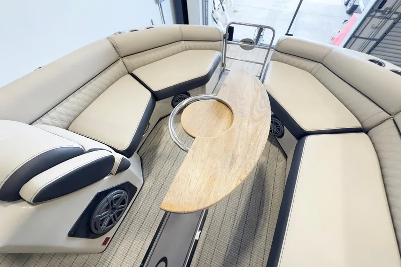 Slide: The Image of Luxurious seating area on a 2017 Harris Crowne 250 pontoon boat with elegant wood table. - 12