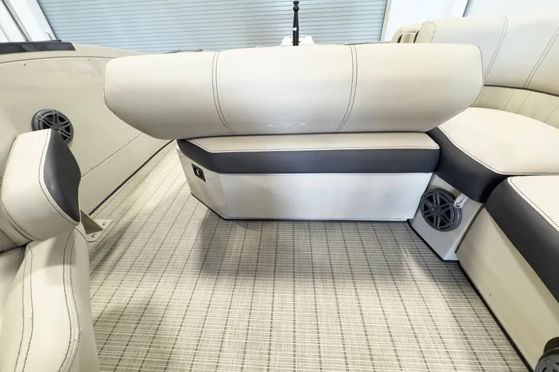 Slide: The Image of Luxurious interior of 2017 Harris Crowne 250 pontoon boat with plush seating and speaker system. - 16