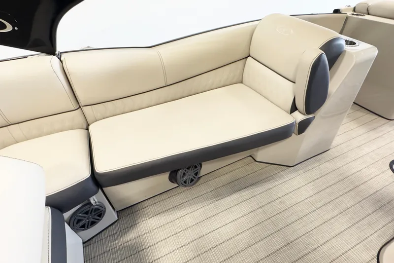 Slide: The Image of 2017 Harris Crowne 250 boat interior with beige seating and integrated speakers. - 8