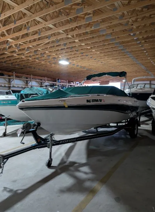 Slide: The Image of 2002 Four Winns 200 Horizon boat in storage facility. - 6
