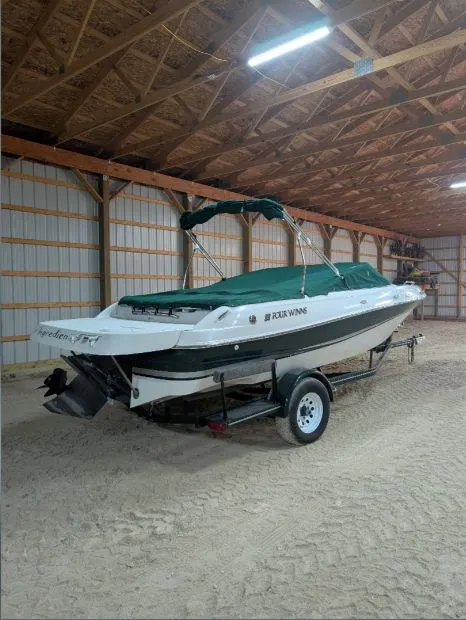 Slide: The Image of 2002 Four Winns 200 Horizon boat in storage on trailer. - 8