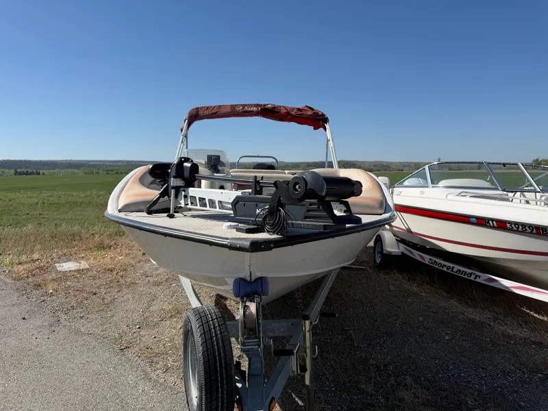 Slide: The Image of 2007 Tahiti Offshore Boats Suncruiser 220 on trailer, parked outdoors. - 5
