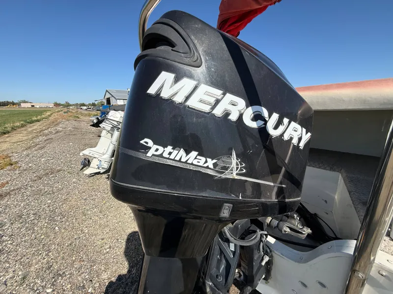 Slide: The Image of Mercury OptiMax outboard motor on Tahiti Offshore Suncruiser 220, year 2007. - 6