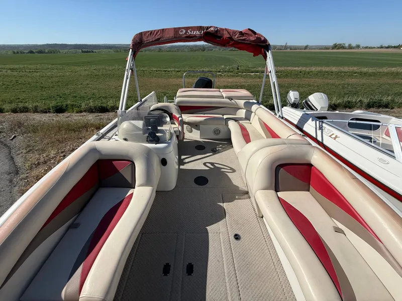 Slide: The Image of 2007 Tahiti Offshore Boats Suncruiser 220 with red and beige seating. - 9
