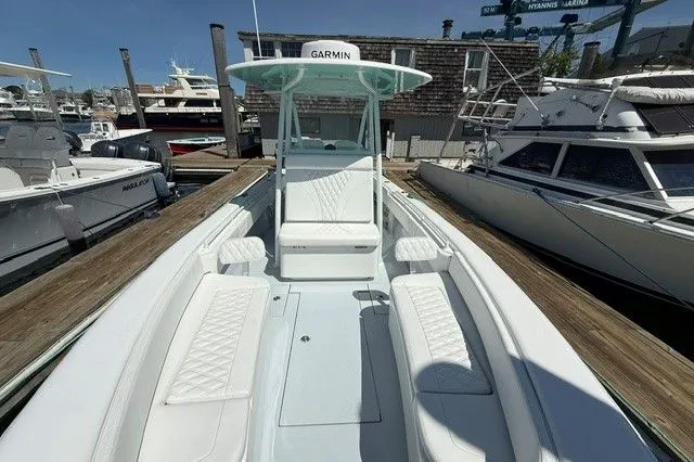 Slide: The Image of 2024 Contender 28 Tournament boat docked, featuring Garmin equipment. - 10