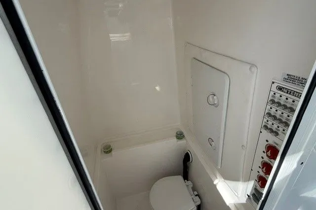 Slide: The Image of Interior of 2024 Contender 28 Tournament with toilet and control panel. - 16
