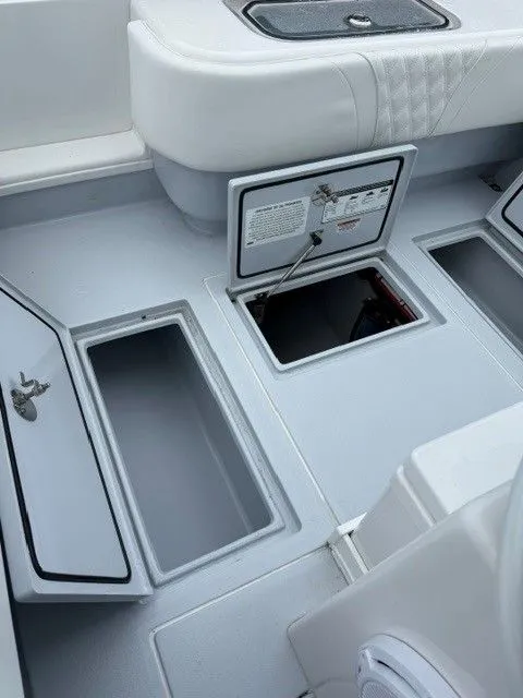 Slide: The Image of 2024 Contender 28 Tournament boat with open storage compartments. - 17