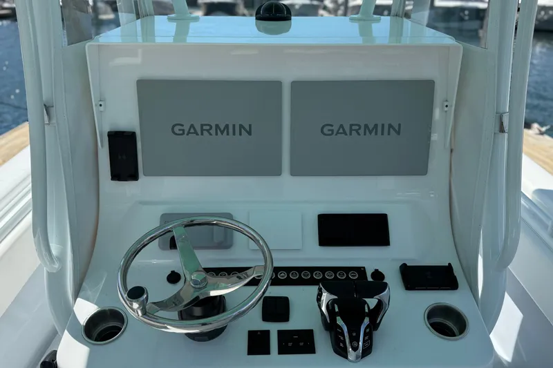 Slide: The Image of 2024 Contender 28 Tournament boat console with Garmin displays. - 3