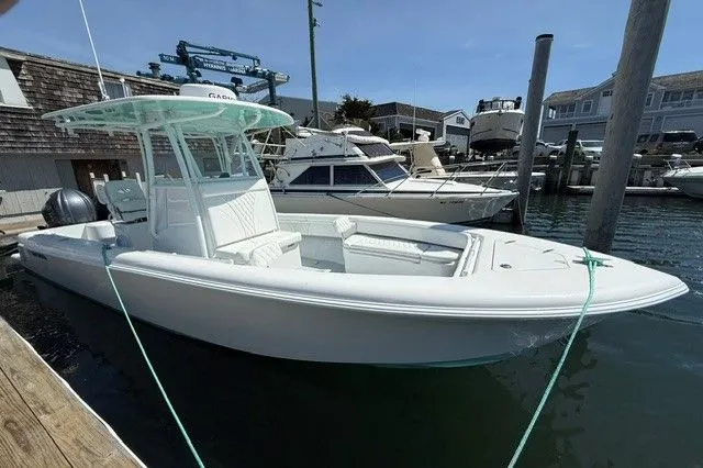 Slide: The Image of 2024 Contender 28 Tournament boat docked in marina. - 5