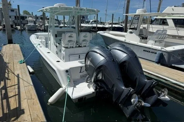 Slide: The Image of 2024 Contender 28 Tournament boat docked at marina. - 7