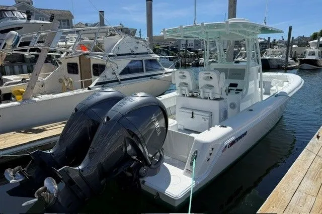 Slide: The Image of 2024 Contender 28 Tournament boat docked with dual engines. - 8