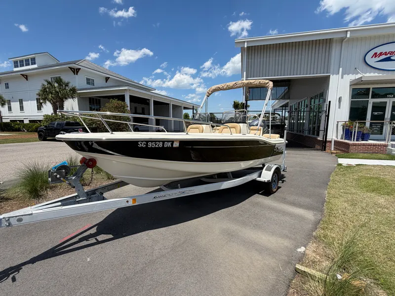 Slide: The Image of 2019 Scout 175 Sport Dorado on trailer outside a building. - 0