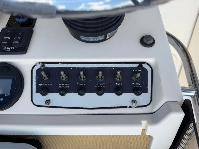 Slide: The Image of Control panel of a 2019 Scout 175 Sport Dorado boat. - 12