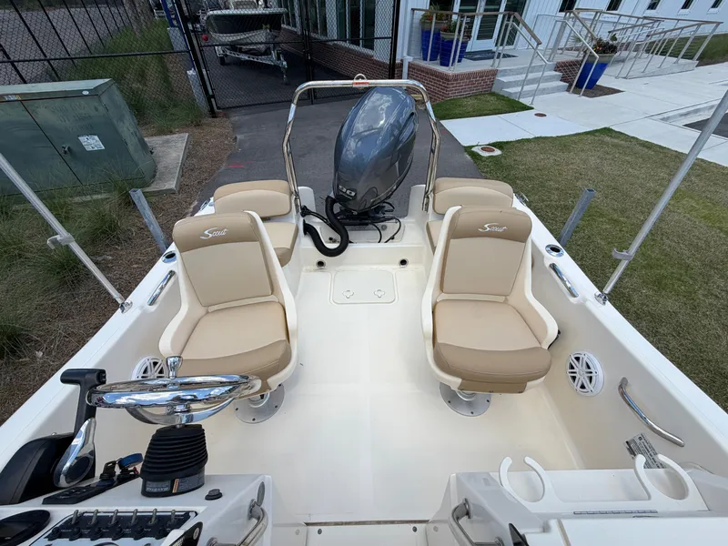 Slide: The Image of Interior view of a 2019 Scout 175 Sport Dorado boat with beige seats. - 5