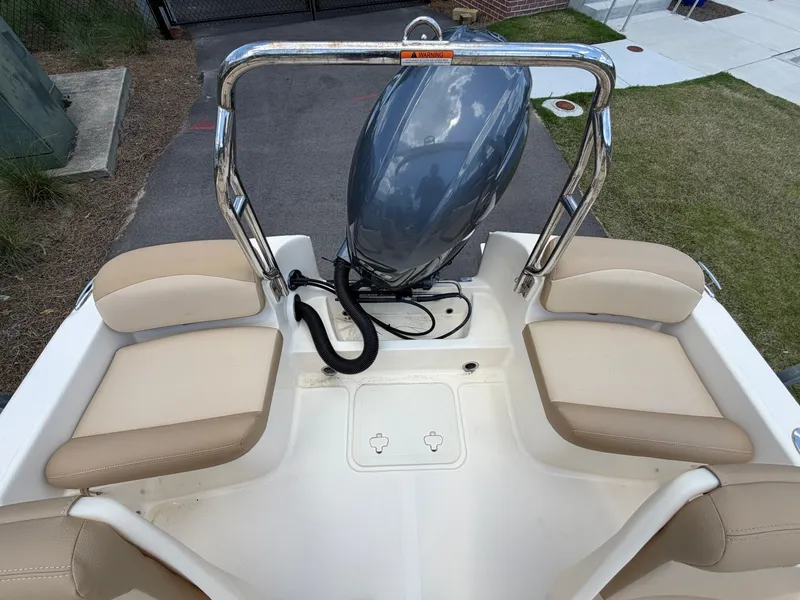 Slide: The Image of Rear view of a 2019 Scout 175 Sport Dorado boat with outboard motor. - 6