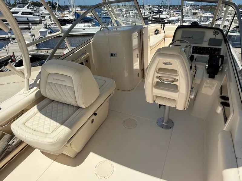 Slide: The Image of Interior of a 2020 Grady-White Freedom 255 boat at the marina. - 14