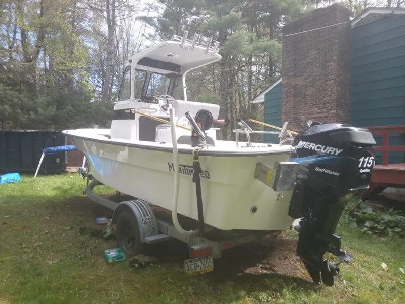 Slide: The Image of 2010 Maritime International Pioneer boat with Mercury outboard motor. - 10