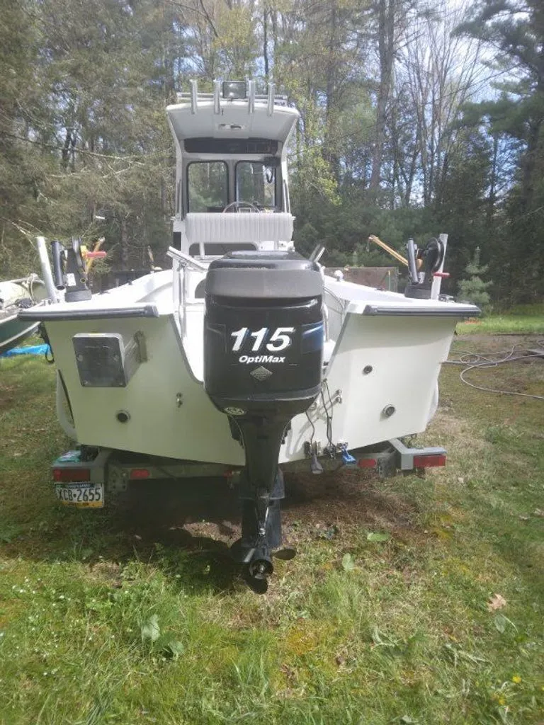 Slide: The Image of 2010 Maritime International Pioneer boat with 115 OptiMax engine. - 11