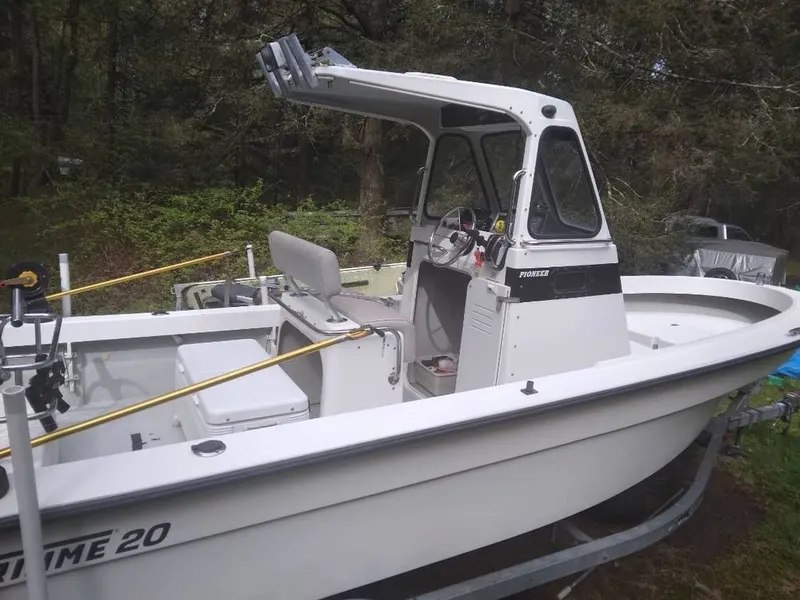 Slide: The Image of 2010 Maritime International Pioneer boat on trailer in forest. - 2