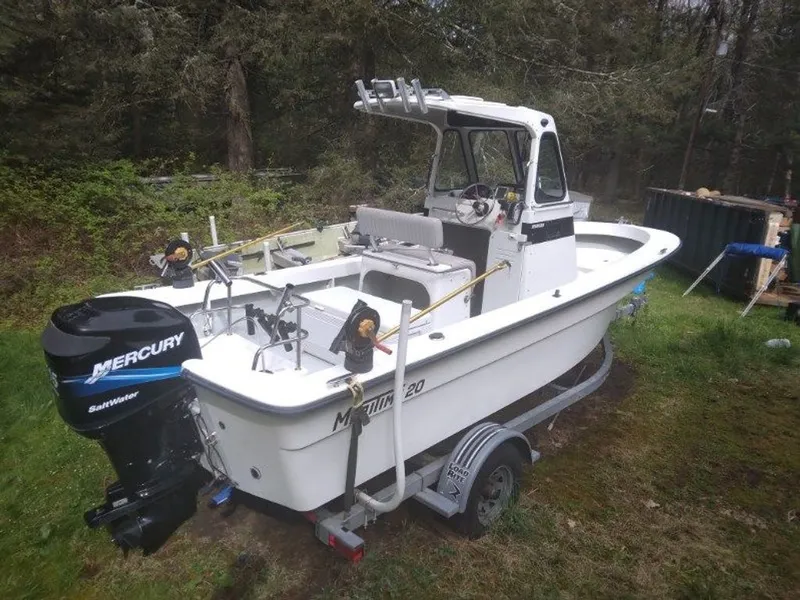 Slide: The Image of 2010 Maritime International Pioneer boat with Mercury outboard motor. - 3