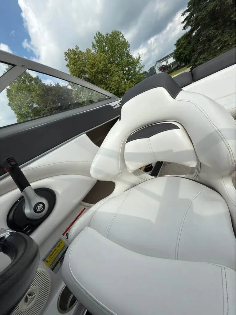 Slide: The Image of Interior of a 2010 Four Winns H210 boat with white seating. - 4