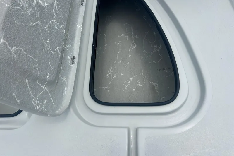 Slide: The Image of Hatch detail of Skuta 24, 2025 model, featuring a sleek, modern design with marbled texture. - 10