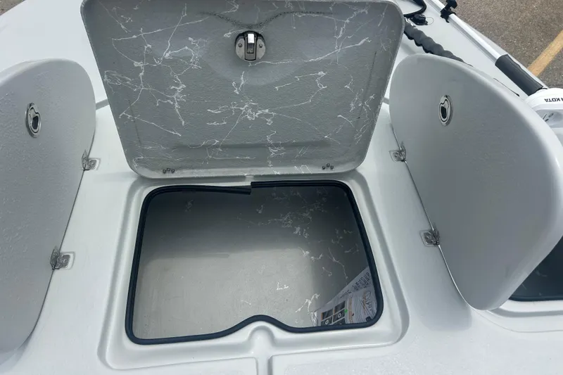Slide: The Image of Open storage compartment on a 2025 Skuta 24 boat, showcasing interior space. - 11
