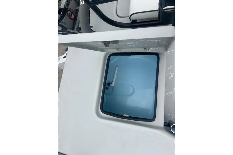 Slide: The Image of Livewell compartment on a 2025 Skuta 24 boat, featuring a sleek design. - 19
