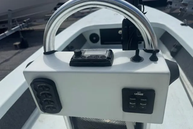 Slide: The Image of Control panel of a 2013 Ankona Native SUV boat with steering and switches. - 5
