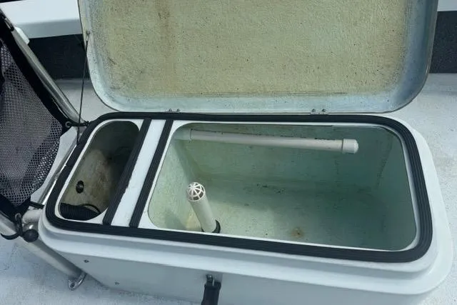 Slide: The Image of Open storage compartment in a 2013 Ankona Native SUV boat. - 7
