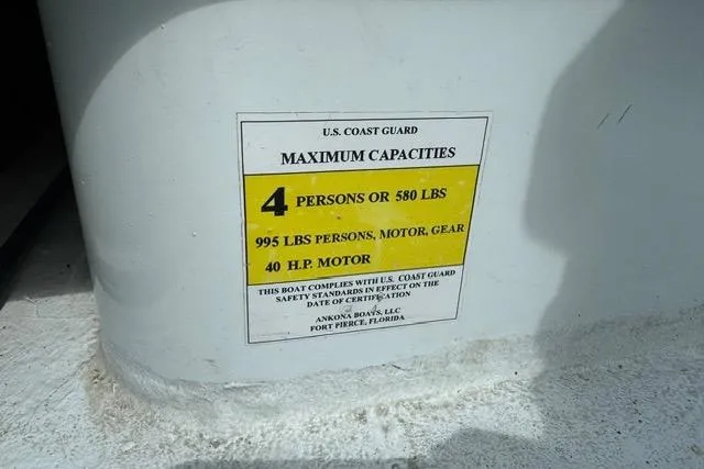 Slide: The Image of U.S. Coast Guard capacity label on 2013 Ankona Native SUV boat, detailing weight and motor limits. - 9