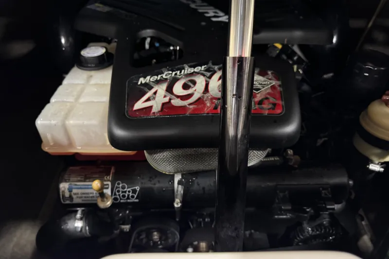 Slide: The Image of Close-up of a 2007 Bryant boat engine, featuring a MerCruiser 496 model. - 12