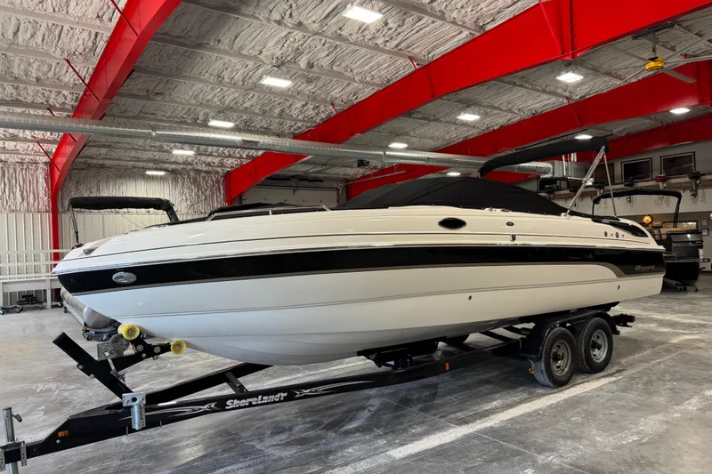 Slide: The Image of 2007 Bryant boat on trailer in a spacious indoor storage facility. - 14