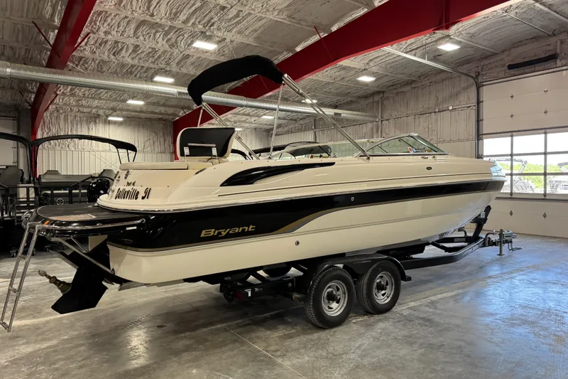Slide: The Image of 2007 Bryant boat on trailer in indoor storage facility. - 3