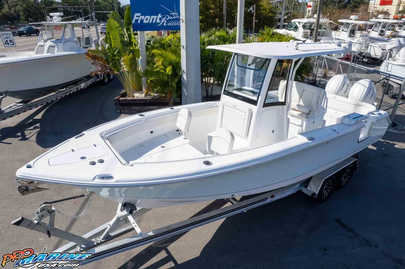 Slide: The Image of 2026 Sea Hunt Ultra 265 SE boat on trailer at dealership. - 1