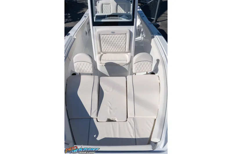 Slide: The Image of 2026 Sea Hunt Ultra 265 SE boat interior with cushioned seating and sleek design. - 34