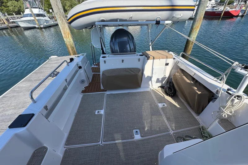 Slide: The Image of 2026 Ranger Tugs R-25 boat deck with inflatable dinghy and motor at marina. - 7