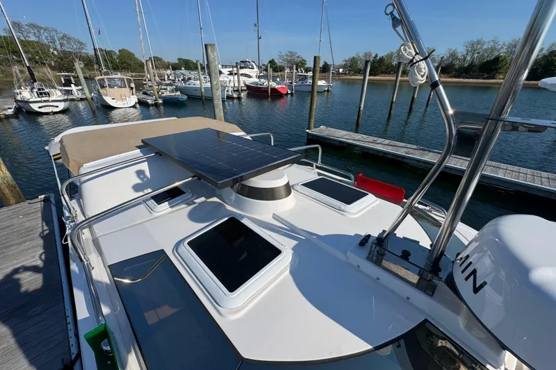 Slide: The Image of 2026 Ranger Tugs R-25 boat with solar panel docked at marina. - 12