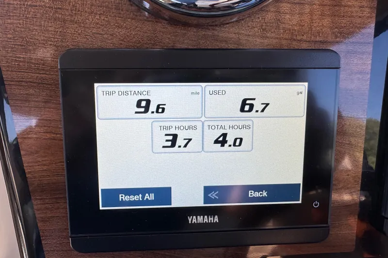 Slide: The Image of Yamaha display showing trip data: 9.6 miles, 6.7 gallons used, 3.7 trip hours. Ranger Tugs R-25. - 15