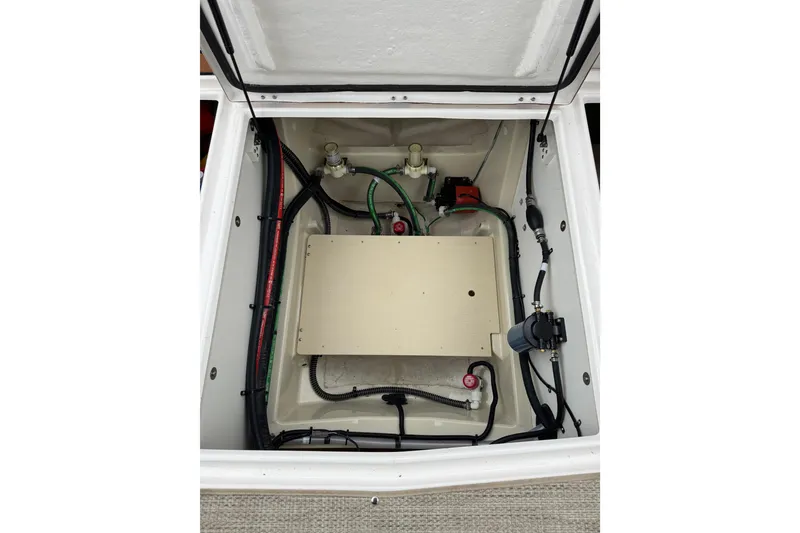 Slide: The Image of Engine compartment of 2026 Ranger Tugs R-25, showcasing wiring and components. - 32
