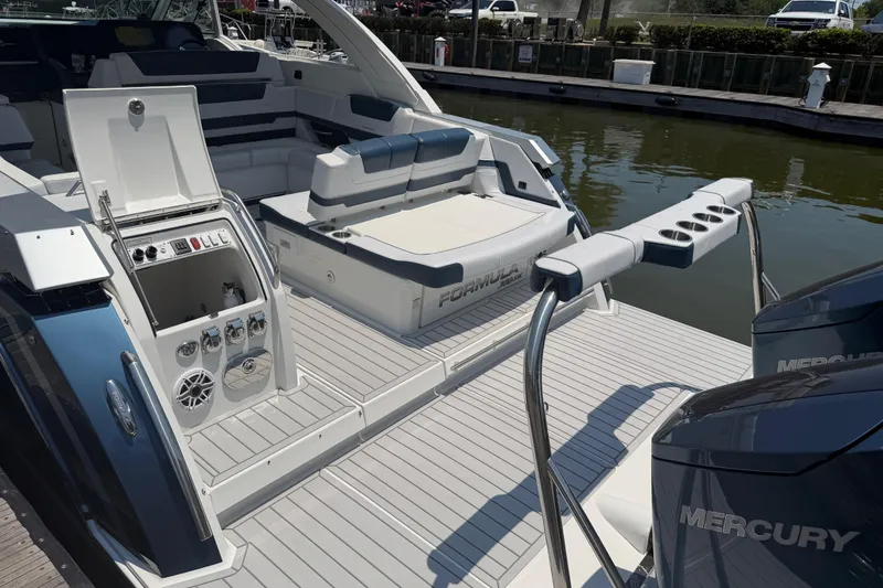 Slide: The Image of 2026 Formula 380 Super Sport Crossover OB boat with luxurious seating and Mercury engines. - 10