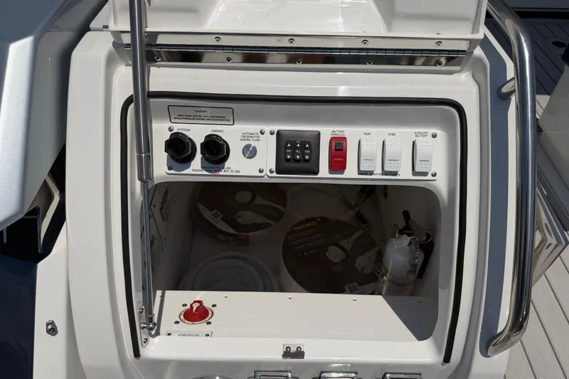 Slide: The Image of Control panel of 2026 Formula 380 Super Sport Crossover OB boat, featuring switches and dials. - 12