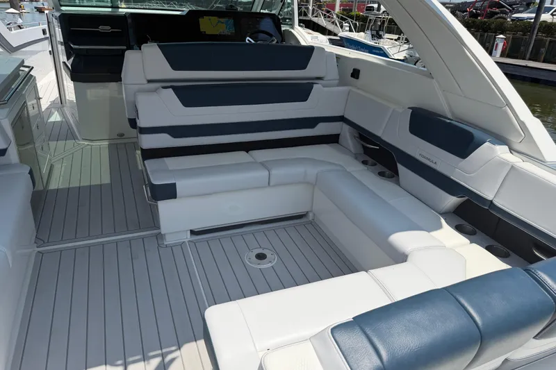 Slide: The Image of 2026 Formula 380 Super Sport Crossover OB boat interior with luxurious seating and sleek design. - 14