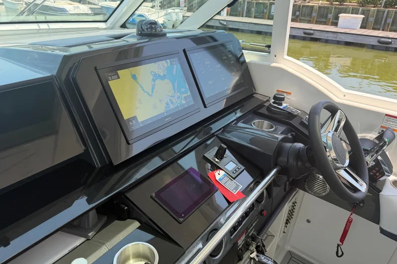 Slide: The Image of Helm of 2026 Formula 380 Super Sport Crossover OB with advanced navigation displays. - 16