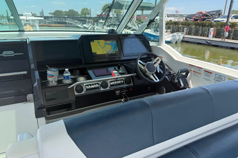 Slide: The Image of Cockpit of 2026 Formula 380 Super Sport Crossover OB with navigation screens and controls. - 17